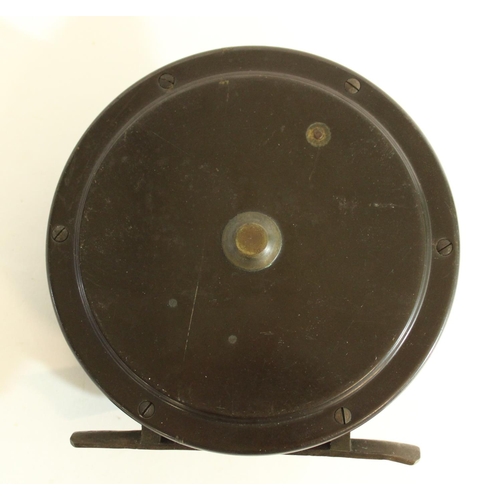 638 - Vintage Large bakelite and brass salmon reel with black ebony handle, dia. 14cm