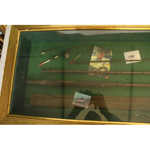 671 - Vintage three piece cane rod displayed in glazed display case with accompanying accroutements.   Cas... 