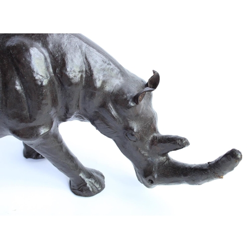 1096 - Mid C20th leather clad model of a rhino, L50cm, H22cm