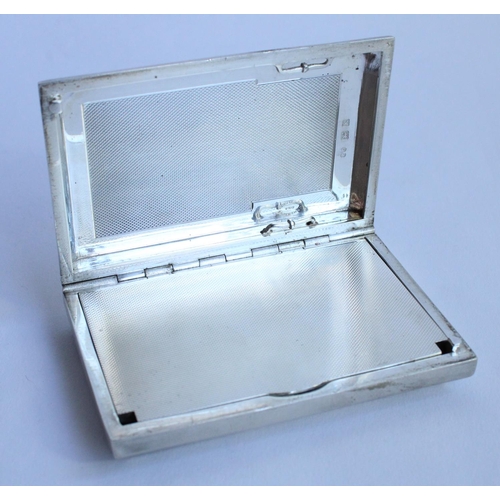 1062 - Geo.V hallmarked silver engine turned rectangular case, slide top lid with engine turned decorated c... 