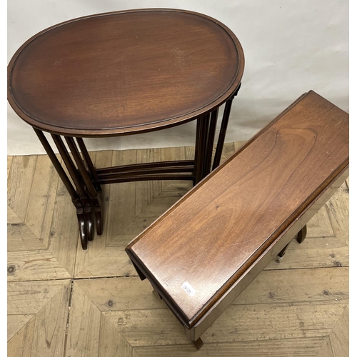 1067 - Small Edwardian mahogany Sutherland table and a nest of three oval tables on turned supports, W52cm ... 