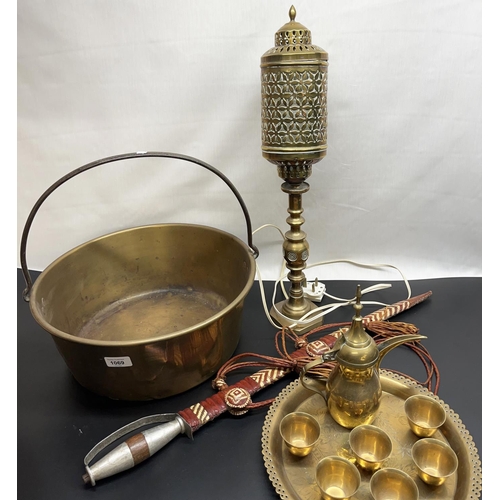 1069 - Brass jam pan with steel handle, brass table lamp, Eastern sword and an Eastern brass coffee set on ... 