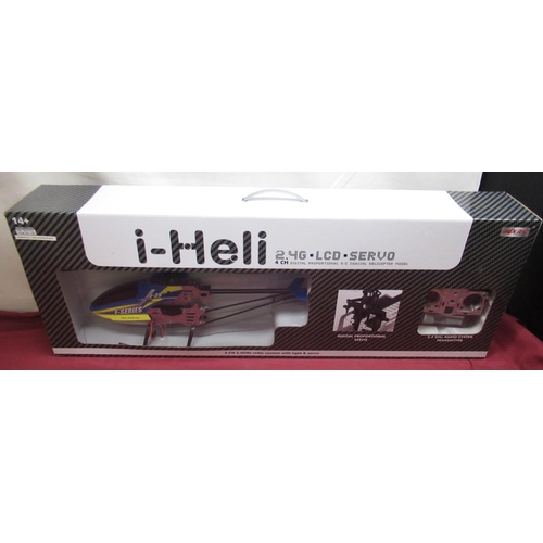 1106 - Boxed as new i-heli 4 CH 2.4GHz radio system with light & servo