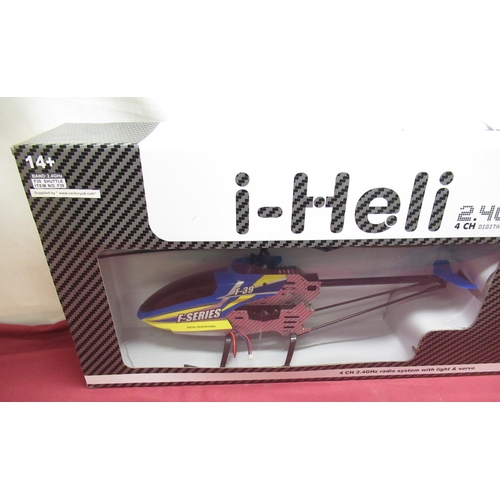 1106 - Boxed as new i-heli 4 CH 2.4GHz radio system with light & servo