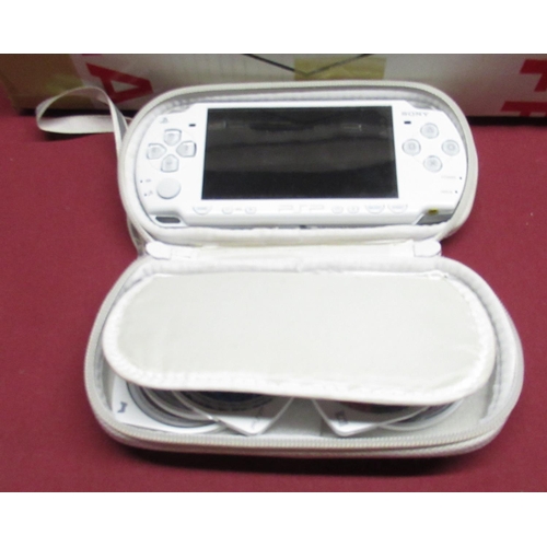 1113 - White PSP handheld console with PSP UMD and Games