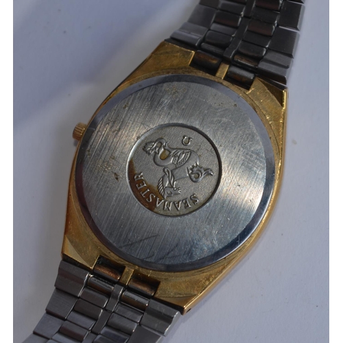 784 - An Omega Seamaster quartz wristwatch with date. Signed gold dial with applied batton hour markers an... 