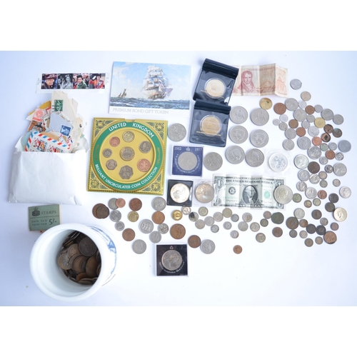 786 - A large collection of coins and commemorative coins including a Britannia fine silver £2 coin from 1... 