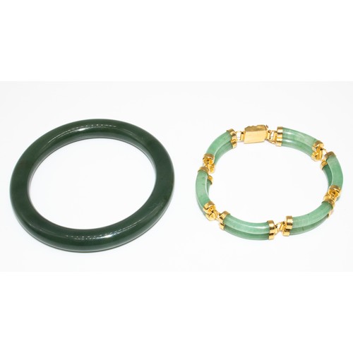 23 - Chinese style yellow metal and Jade bracelet with dragon detail closure, L18cm, and a spinach-green ... 