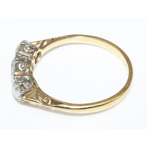 1010 - 18ct yellow gold diamond ring, the large brilliant cut central diamond flanked by two smaller diamon... 