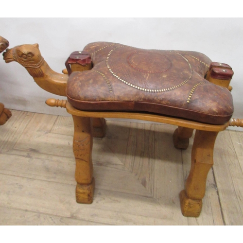 1141 - Pair of Middle Eastern Camel saddles with tooled leather seats