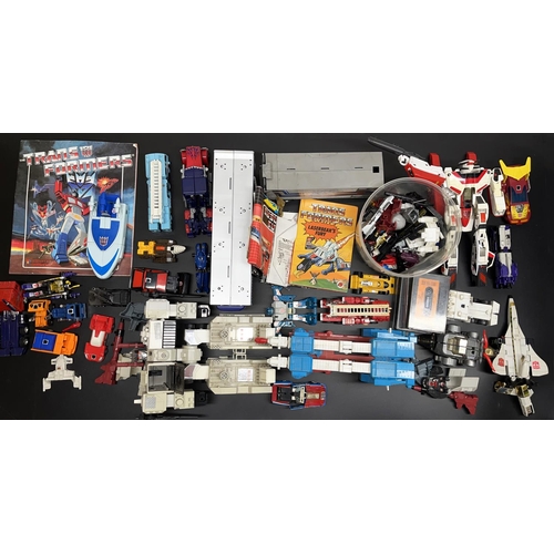 1135 - Collection of Transformers toys, books and cassette tapes