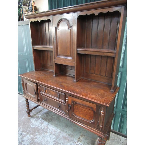 444 - C20th oak dresser, shelved panel back above two drawers and two doors, on bobbin turned legs with st... 