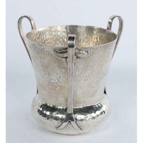 1052 - Edw.VII Arts and Crafts silver tyg, planished tapering body with three scroll handles, makers mark r... 