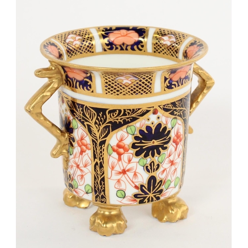 1191 - Early C20th Royal Crown Derby 1128 Imari pattern small vase with geometric handles, on four gilt paw... 