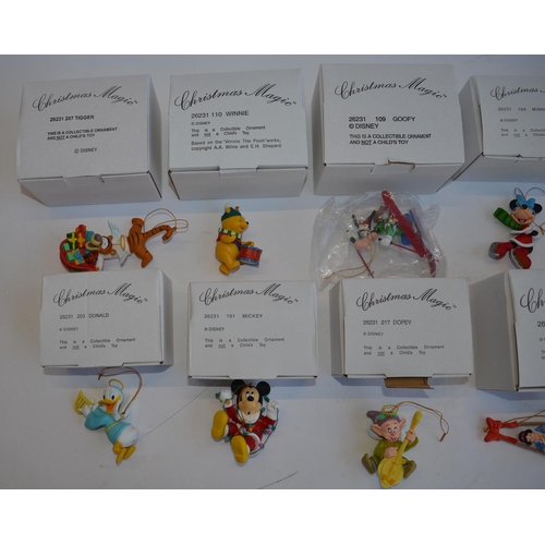 827 - 12 Christmas tree hangers by Disney, all boxed and in excellent condition. Includes Snow White, Goof... 