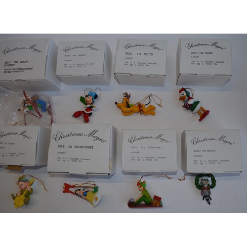 827 - 12 Christmas tree hangers by Disney, all boxed and in excellent condition. Includes Snow White, Goof... 