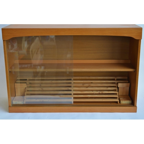 799A - A wood display case with sliding front glass panels. Homemade removeable stepped structure ideal for... 