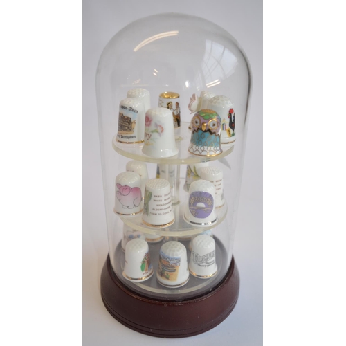 830 - A collection of (mostly) ceramic thimbles with wall hanging display cases, and a glass dome display ... 