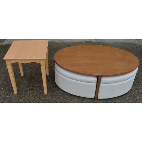 834 - An oval coffee table with 4 pull out padded seats, each with storage space inside. Table dimensions:... 