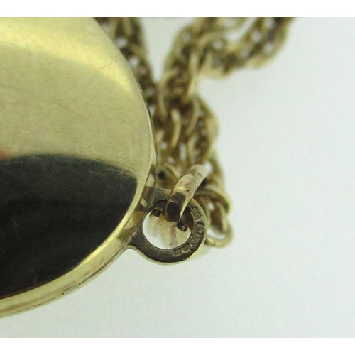 51 - 9ct yellow gold locket set with seed pearls and pale blue stone, stamped 375, on a 9ct gold chain, s... 
