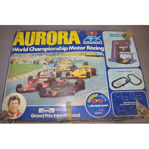 125 - Vintage Aurora AFX Mario Andretti GX6500 slot car racing set.