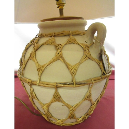 684 - Late 20th century pottery table lamp, with basket weave strapping, cream conical shade (height 66cm)