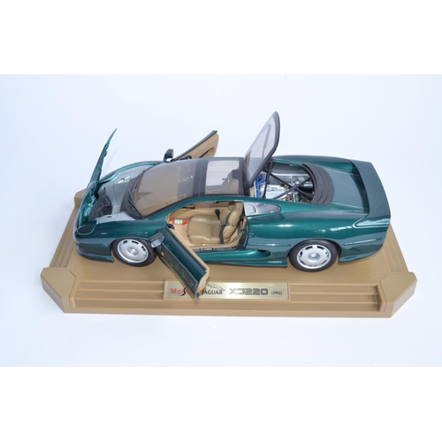 1148 - A Maisto 1/12 scale Jaguar XC220 (1992) attached to original base, no box. This is a large model, ov... 