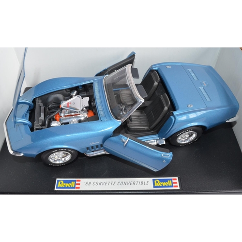 1150 - 2 1/18 scale Revell diecast model cars:
1956 Ford Thunderbird (cat no 8804)
1969 Corvette Convertibl... 