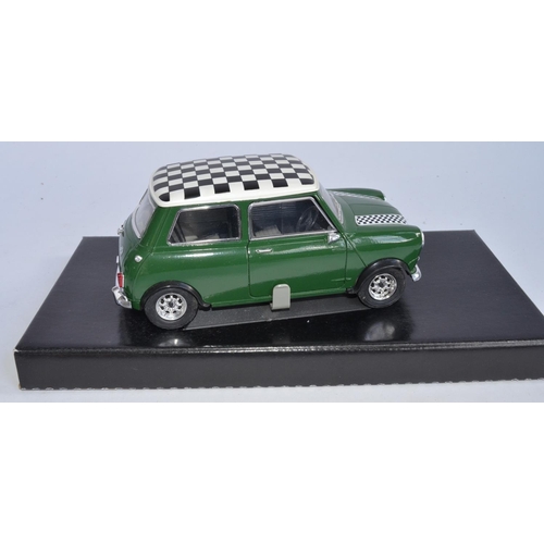 1152 - 2 Solido 1/18 die-cast model cars, a Mini Cooper (no cat no, model as new, box fair missing polystyr... 