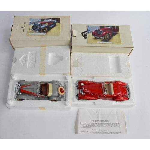 1159 - 2 boxed 1/24 Danbury Mint die-cast model cars:
1934 Packard V12 Le Baron Speedster and a 1935 Duesen... 