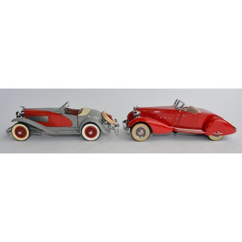 1159 - 2 boxed 1/24 Danbury Mint die-cast model cars:
1934 Packard V12 Le Baron Speedster and a 1935 Duesen... 