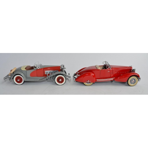 1159 - 2 boxed 1/24 Danbury Mint die-cast model cars:
1934 Packard V12 Le Baron Speedster and a 1935 Duesen... 