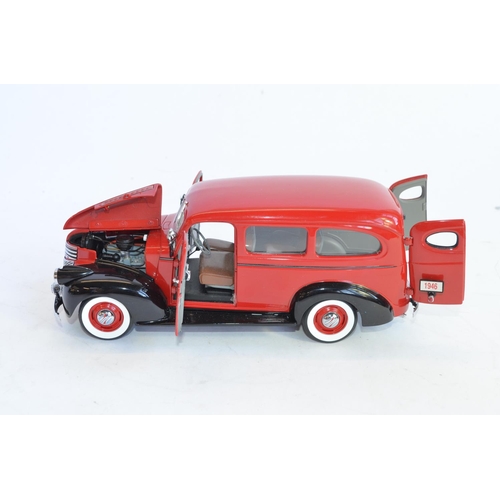 1167 - A boxed 1/24 Danbury Mint 1946 Red & Black Chevrolet Suburban, with certificate.