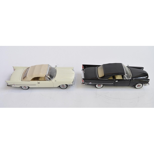 1177 - 2 boxed 1/24 diecast 1957 Crysler 300C convertible model cars:
1 Danbury Mint white version in very ... 