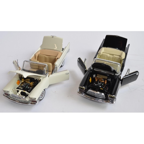 1177 - 2 boxed 1/24 diecast 1957 Crysler 300C convertible model cars:
1 Danbury Mint white version in very ... 