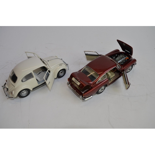 1180 - 3 boxed 1/24 scale die-cast european car models:
A Danbury Mint 1964 Aston Martin DB5, box fair, no ... 