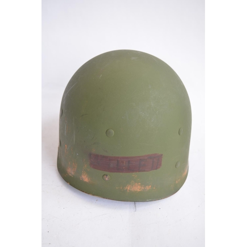 1190 - A US Army WWII M1 Mk1 front seam steel helmet, with liner, chin straps etc.