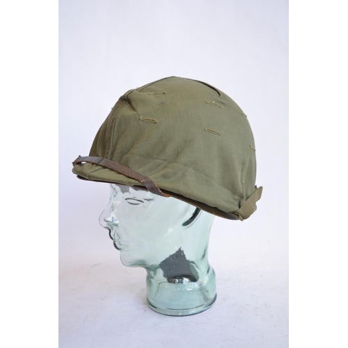 1191 - A US Army M1 Mk2 rear seam steel helmet, with liner, chin straps etc. Helmet has had markings applie... 