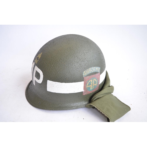 1191 - A US Army M1 Mk2 rear seam steel helmet, with liner, chin straps etc. Helmet has had markings applie... 