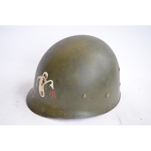 1191 - A US Army M1 Mk2 rear seam steel helmet, with liner, chin straps etc. Helmet has had markings applie... 