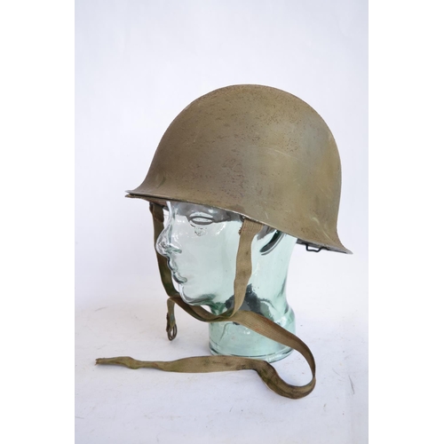 1192 - A French Army 1951 (MS1) post WWII rear seam steel helmet, with liner, straps etc. Unit logo on side... 