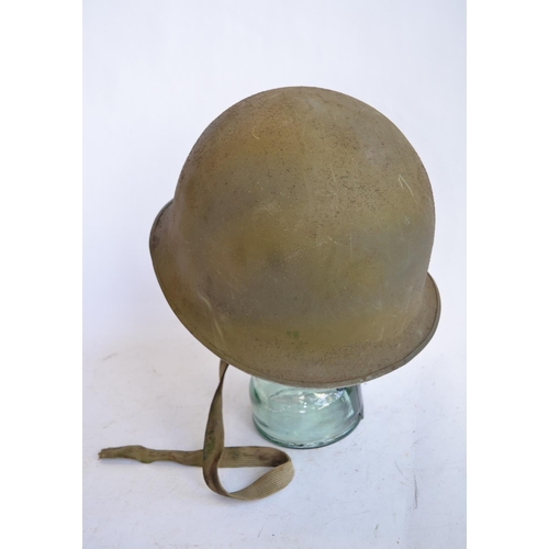 1192 - A French Army 1951 (MS1) post WWII rear seam steel helmet, with liner, straps etc. Unit logo on side... 