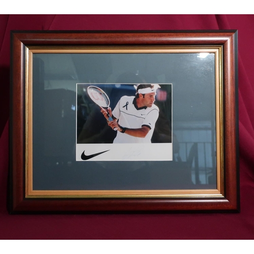 1221 - Framed and mounted photograph possibly signed by Roger Federer (no COA)