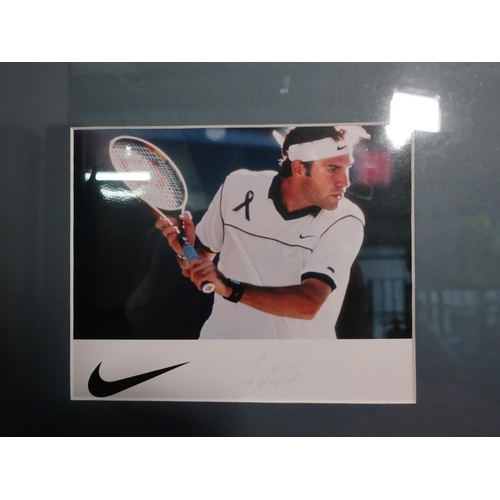 1221 - Framed and mounted photograph possibly signed by Roger Federer (no COA)