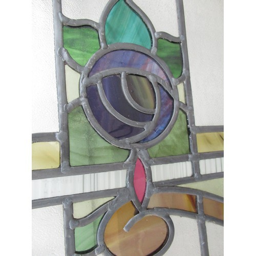 1205 - Three leaded stained glass window panels, decorated with scrolling foliage, W50cm H115cm (3)