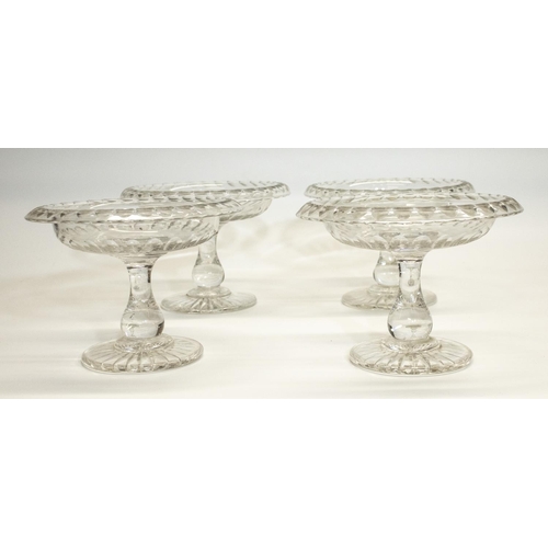 1135 - Set of four Georgian style glass Tazza, folded rim decorated with ovals, baluster stems with star cu... 