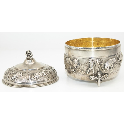 1043 - C20th Indian silver circular bowl and cover, with Ganesha finial, decorated with bands of animals an... 