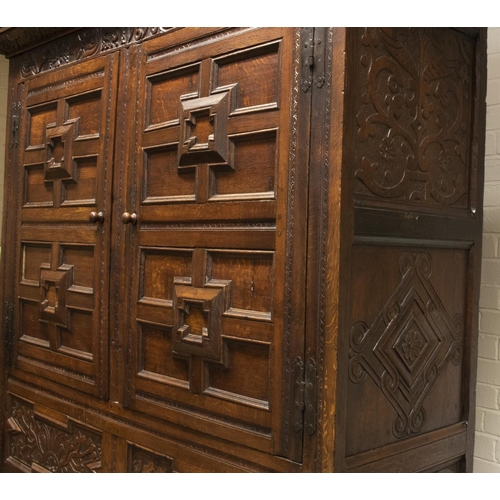 2195 - The Grange Goathland - C17th and later carved oak Armoire, lunette cornice with animal head frieze d... 