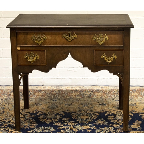 1404 - Small Geo. III mahogany lowboy, with one long and two short cockbeaded drawers with shaped apron, an... 