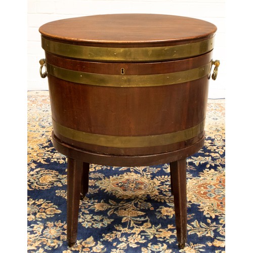 1395 - Geo. III brass banded coopered mahogany oval wine cooler, with hinged top and two brass carry handle... 